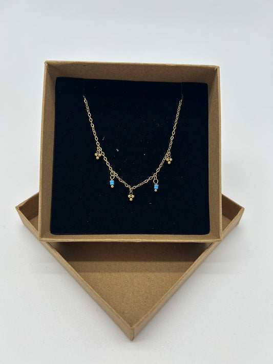 GOLD NECKLACE WITH GOLD TURQUOISE CHARMS