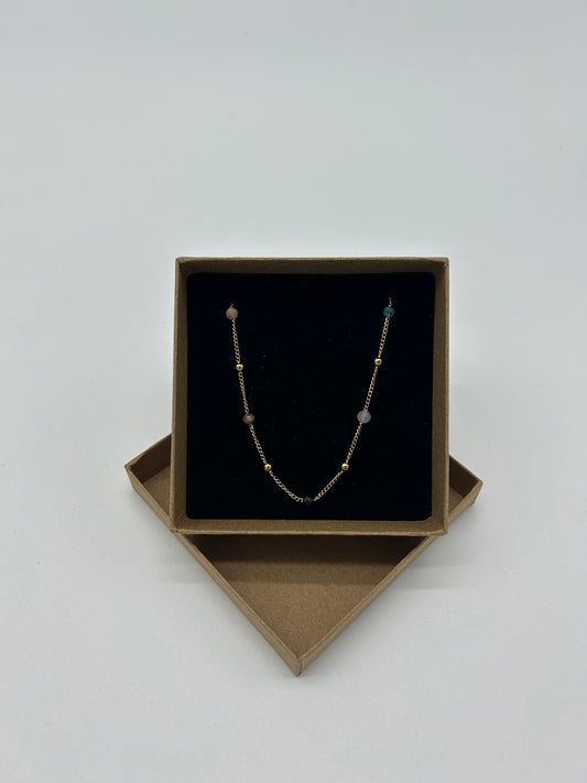 GOLD NECKLACE WITH DARK BEADS